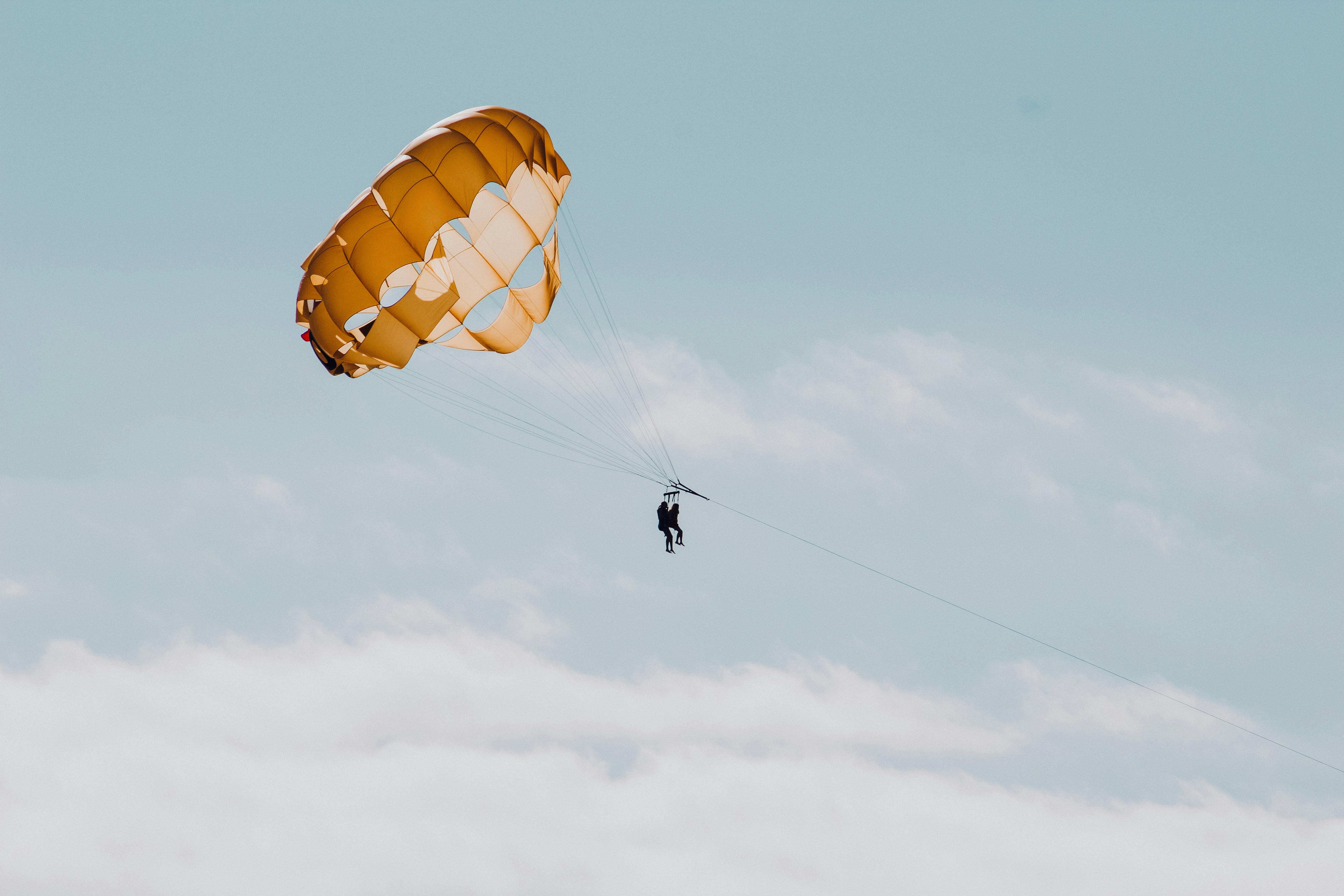 Floating in the sky by Free IQ Tests man in parachute