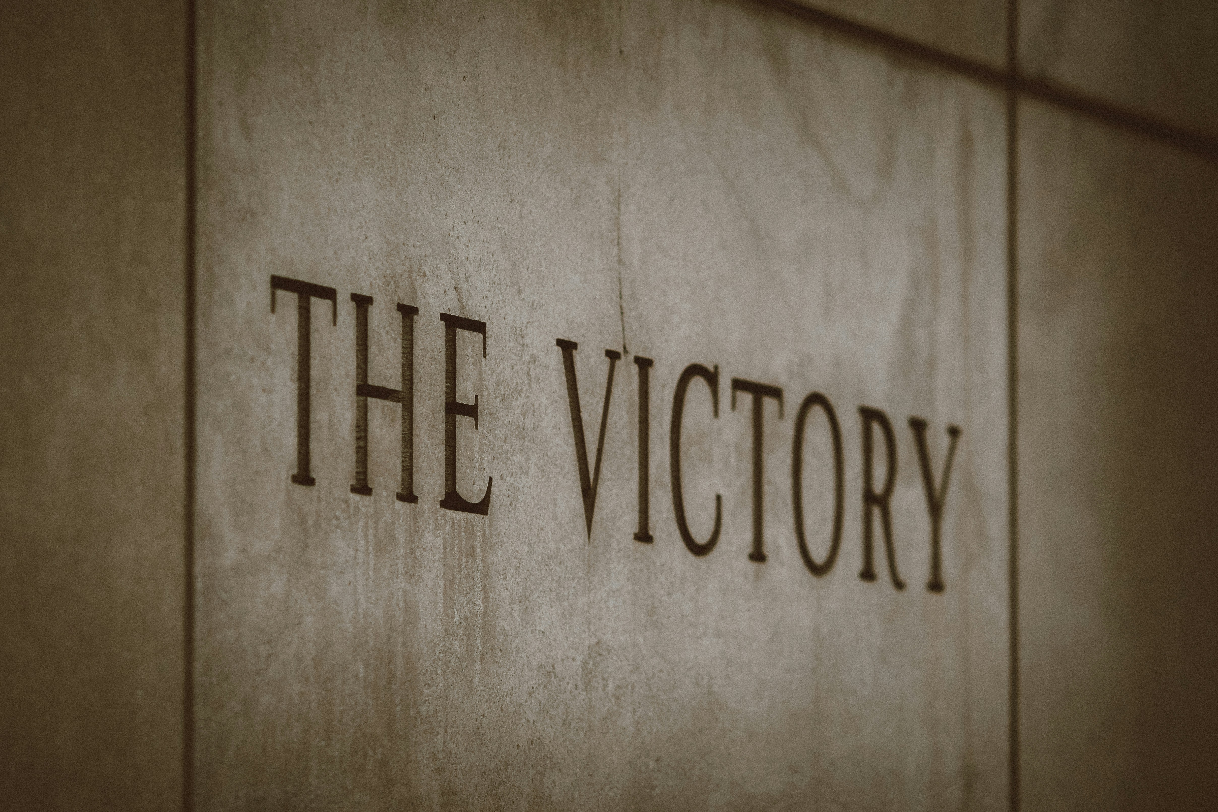 the victory sign on the side of a building